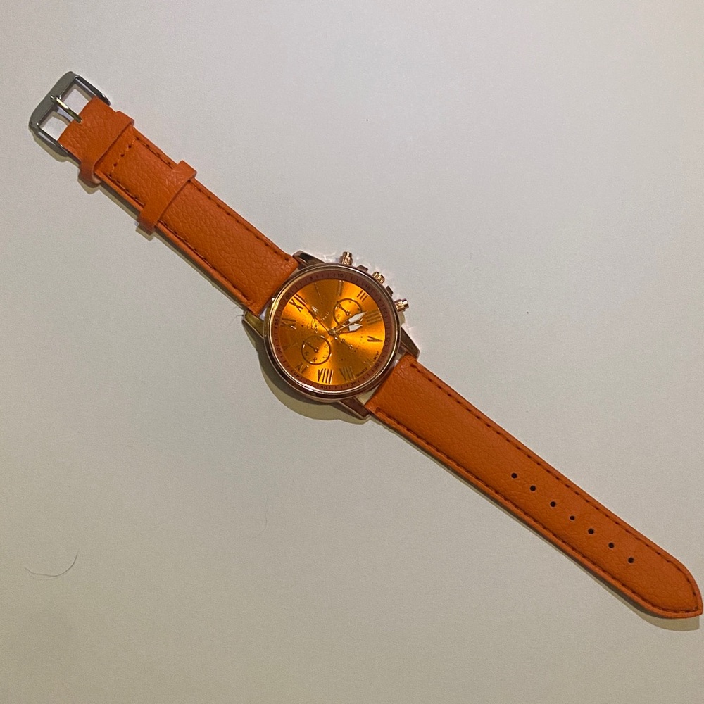 Rose Gold Geneva Platinum Quartz watch with genuine leather straps.